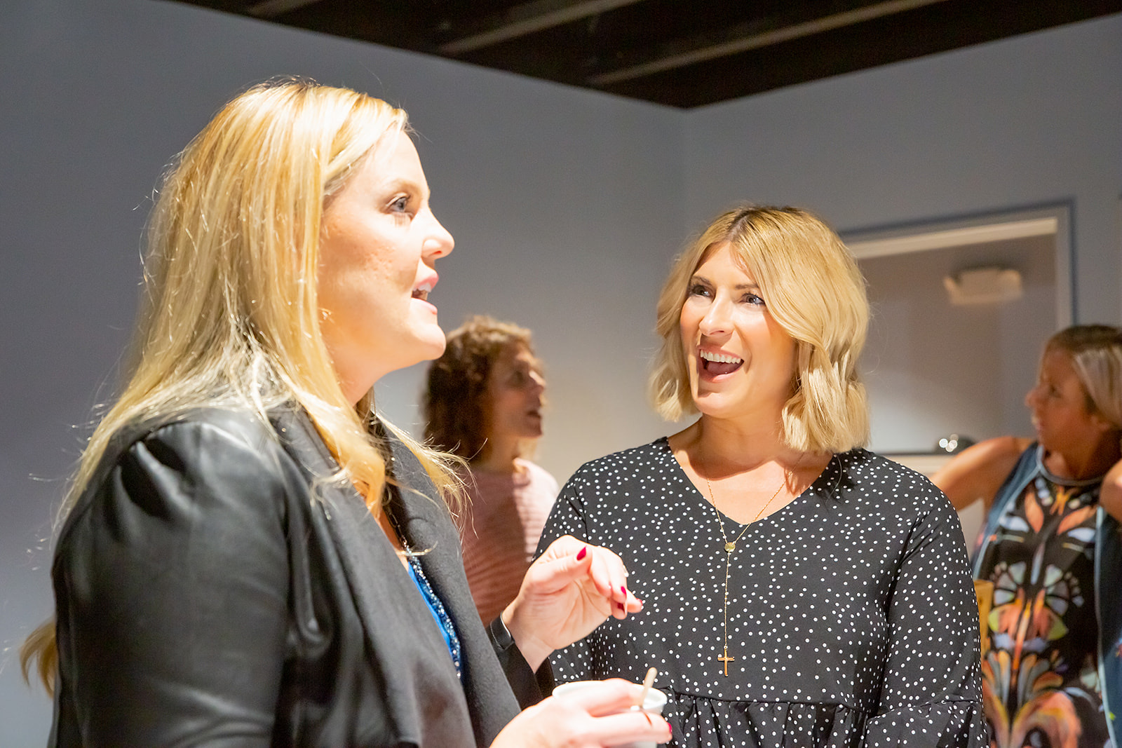 Two women in animated conversation