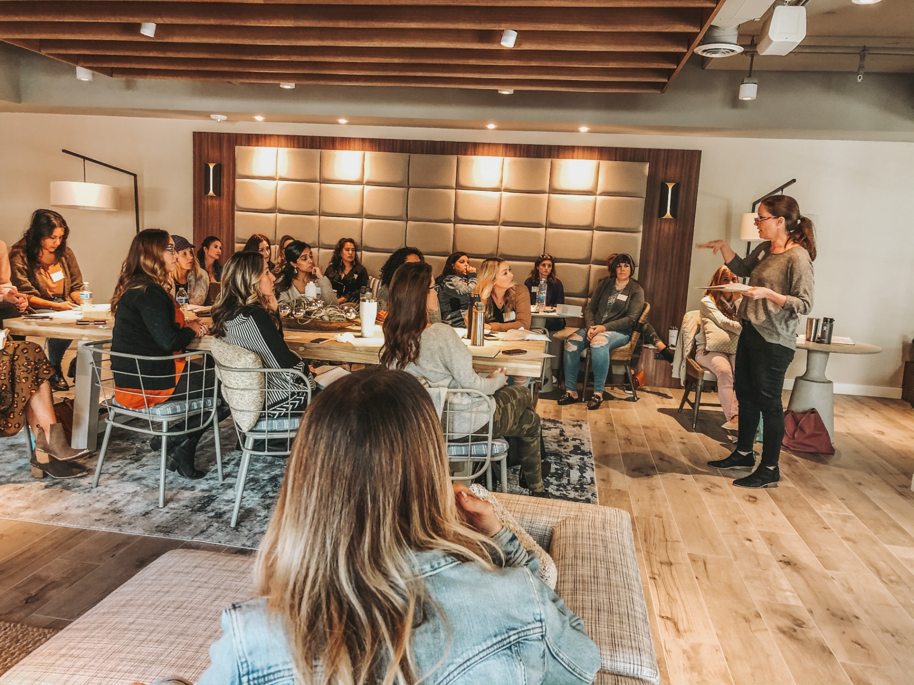 Women gathered around a table for a teaching