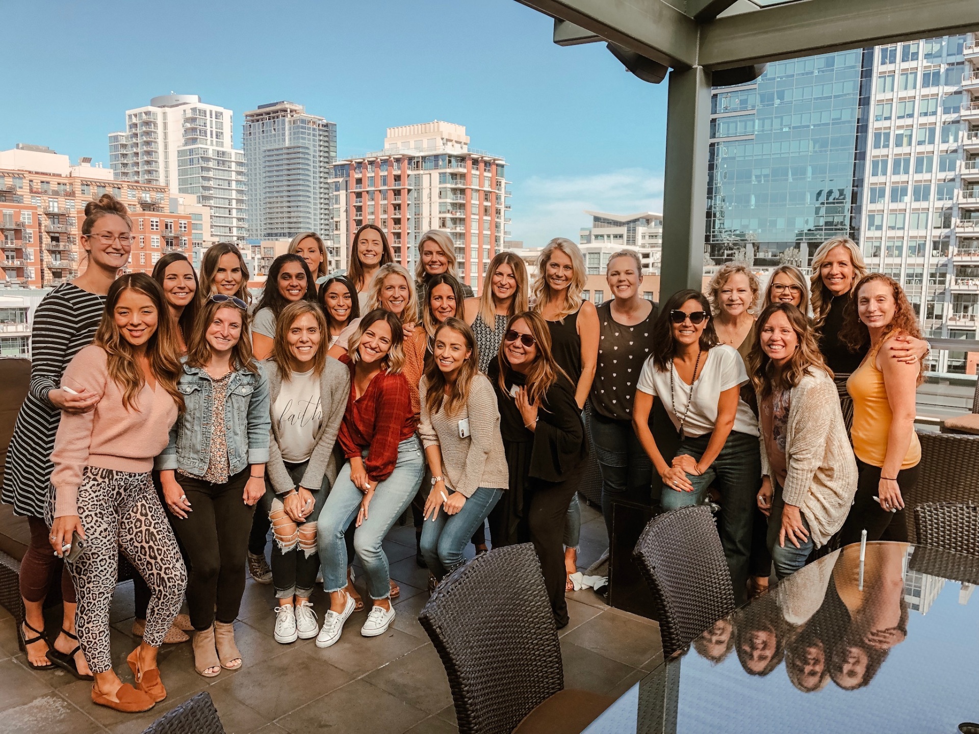 Group photo of women at a Healing Her rooftop gathering
