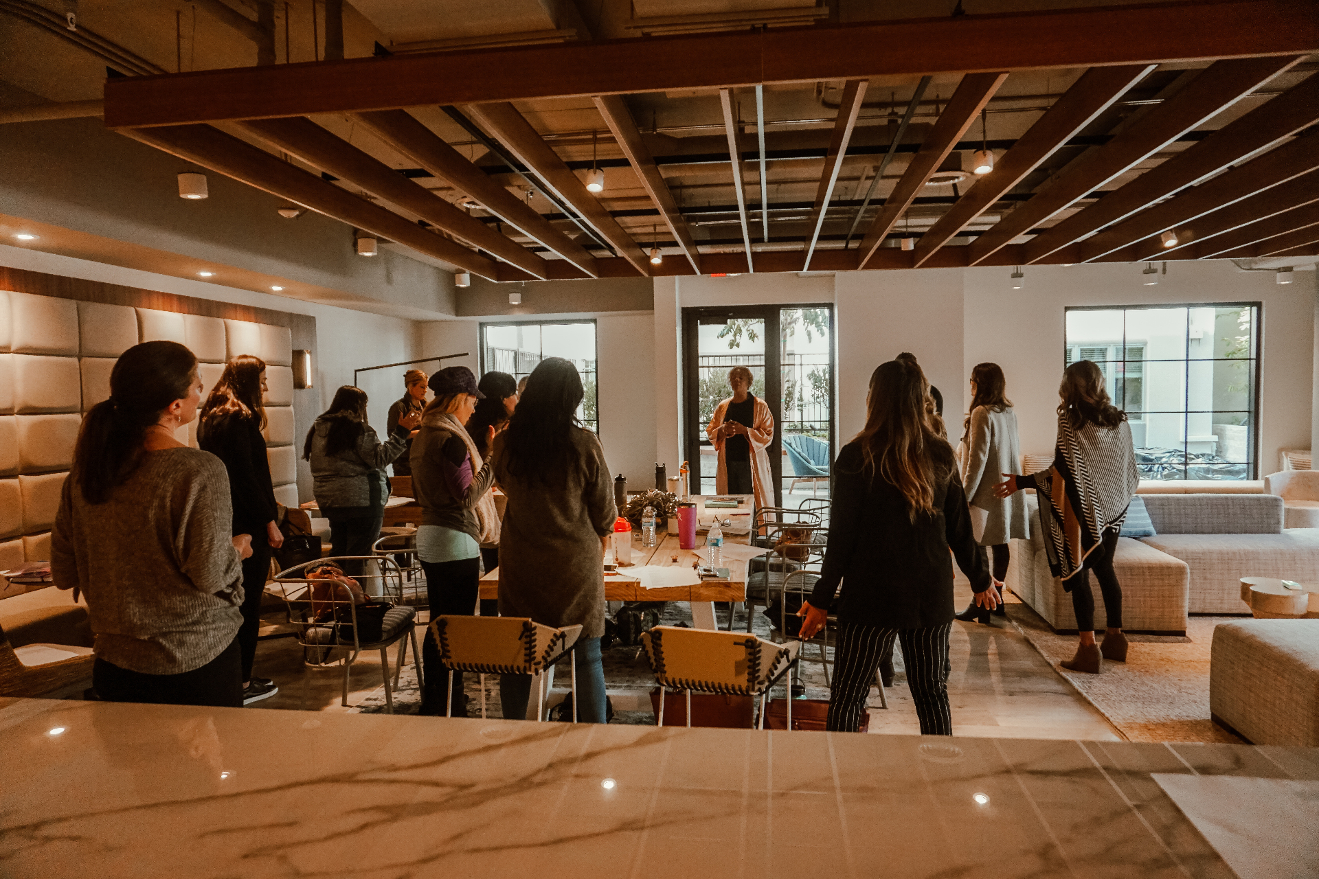 Women gathered in a loft space for teaching