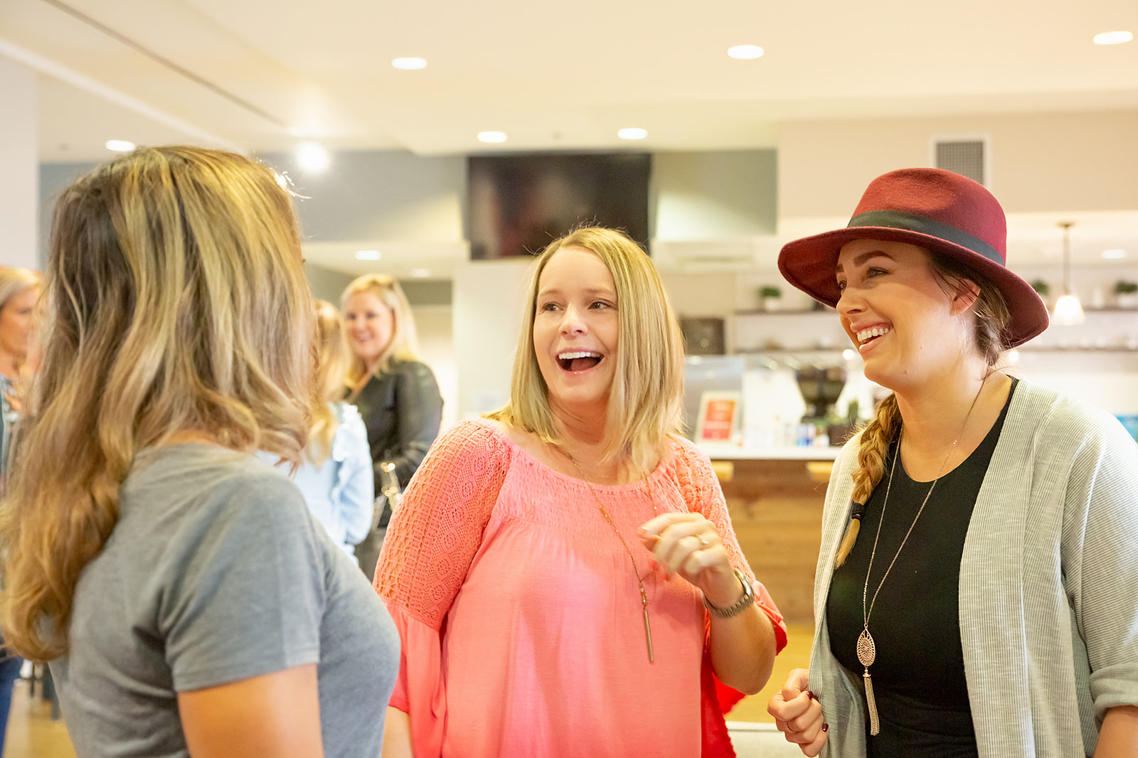 Women laughing together at a gathering